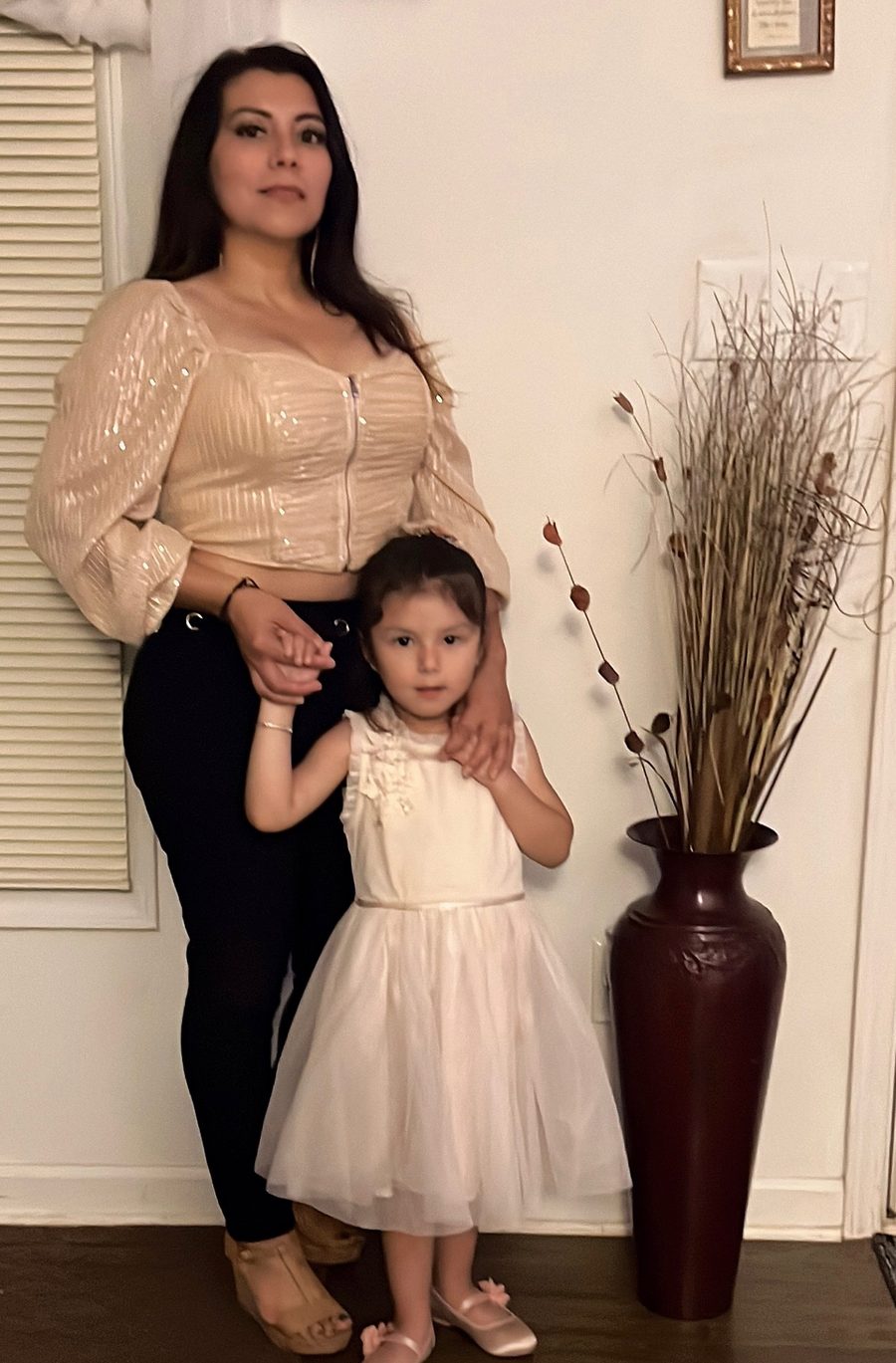 Karina at home with her young daughter